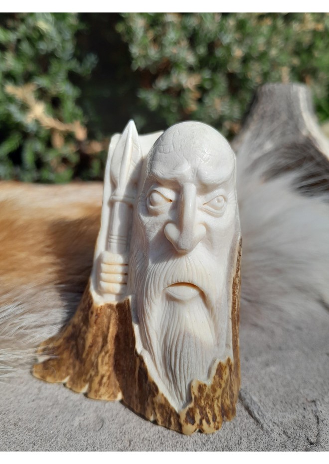 Statue of god Odin with a spear. Moose antlers hand-carved.