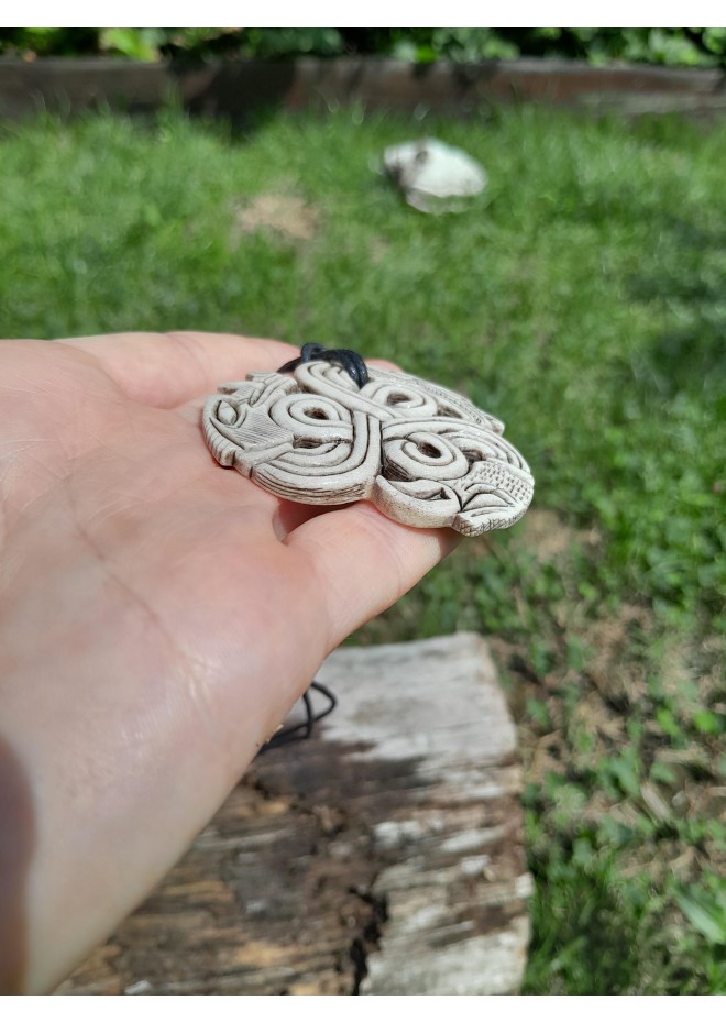 A triskelion amulet with heads of a Boar, Raven and Wolf. Norse, pagan jewelry. Norse mythology art. Altarpiece.