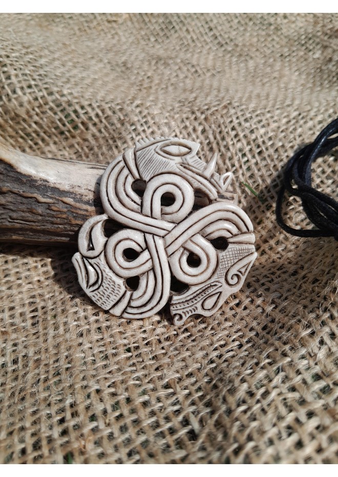 A triskelion amulet with heads of a Boar, Raven and Wolf. Norse, pagan jewelry. Norse mythology art. Altarpiece.