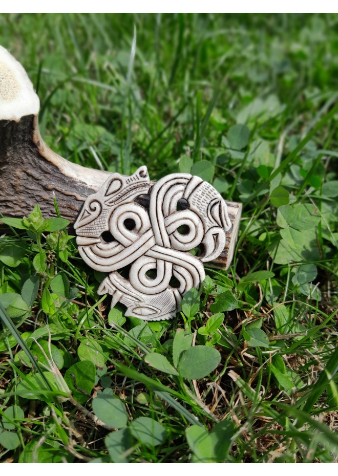 A triskelion amulet with heads of a Boar, Raven and Wolf. Norse, pagan jewelry. Norse mythology art. Altarpiece.