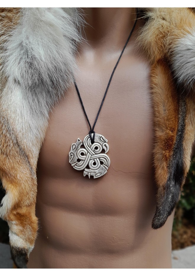 A triskelion amulet with heads of a Boar, Raven and Wolf. Norse, pagan jewelry. Norse mythology art. Altarpiece.