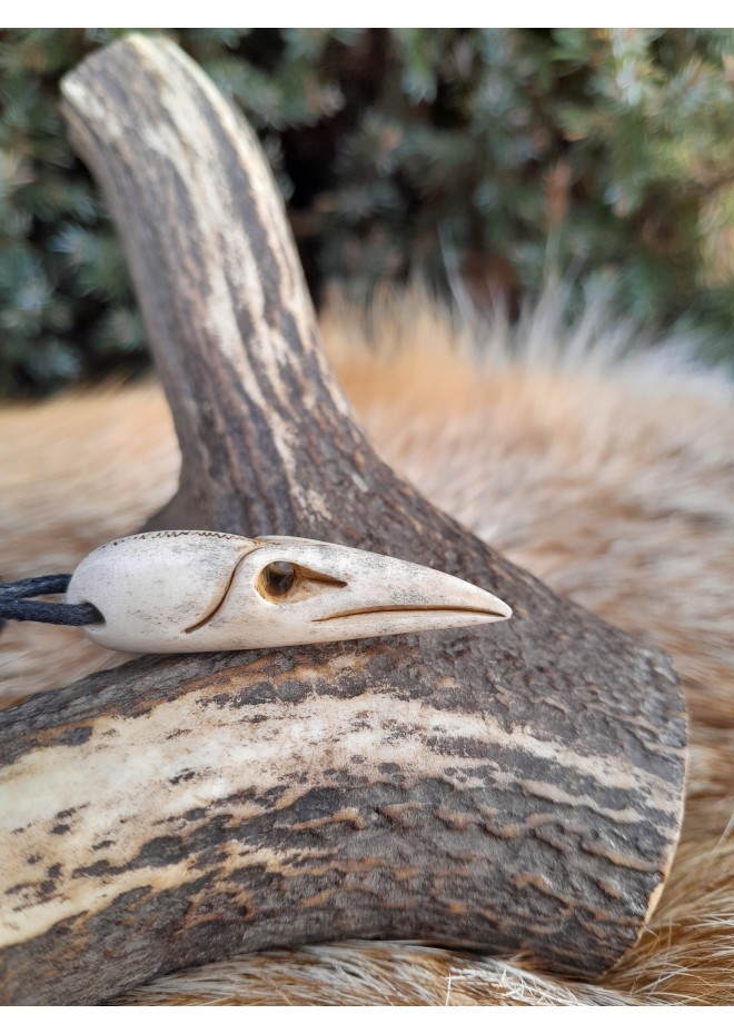 Small hand-carved Viking Raven skull amulet inspired by Norse mythology.