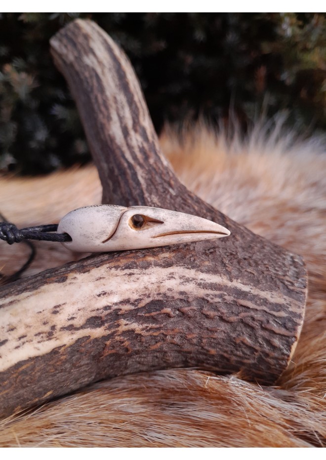 Small hand-carved Viking Raven skull amulet inspired by Norse mythology.