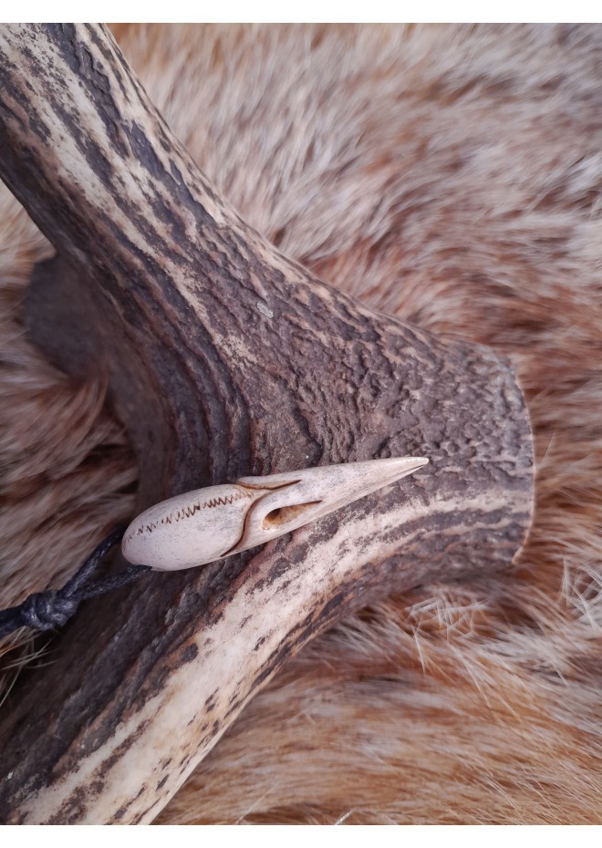 Small hand-carved Viking Raven skull amulet inspired by Norse mythology.