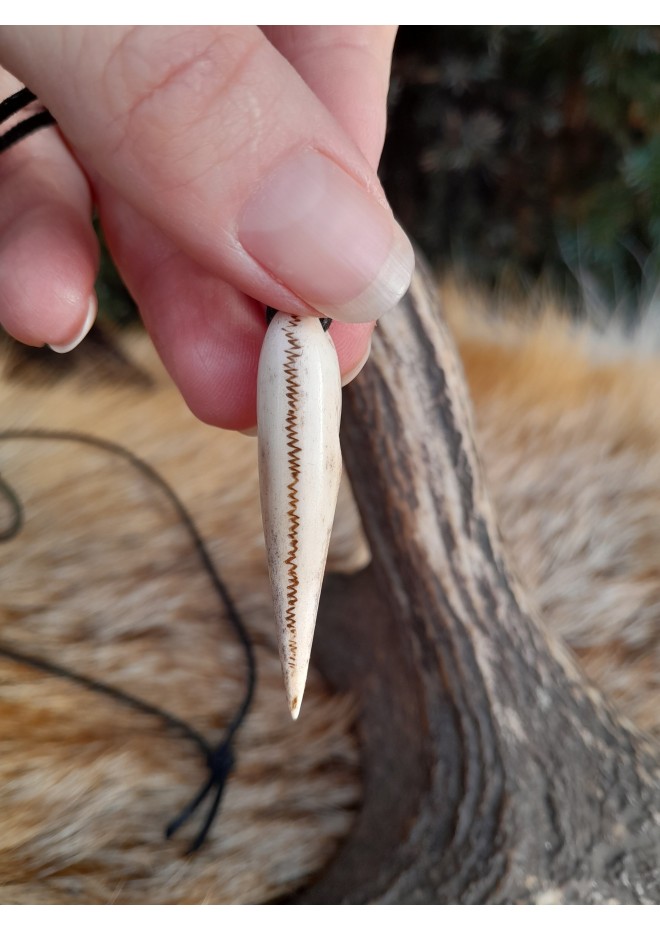 Small hand-carved Viking Raven skull amulet inspired by Norse mythology.