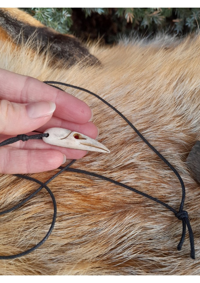 Small hand-carved Viking Raven skull amulet inspired by Norse mythology.