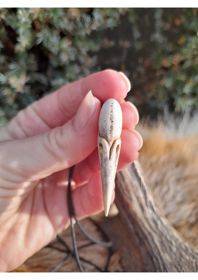 Small hand-carved Viking Raven skull amulet inspired by Norse mythology.