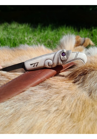 Viking knife with hand-carved Raven handle. Hand-forged carbon steel blade and leather sheath. 