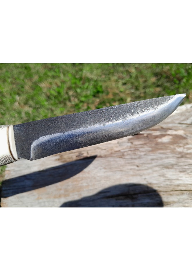 Viking knife with hand-carved Raven handle. Hand-forged carbon steel blade and leather sheath. 