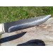 Viking knife with hand-carved Raven handle. Hand-forged carbon steel blade and leather sheath. 