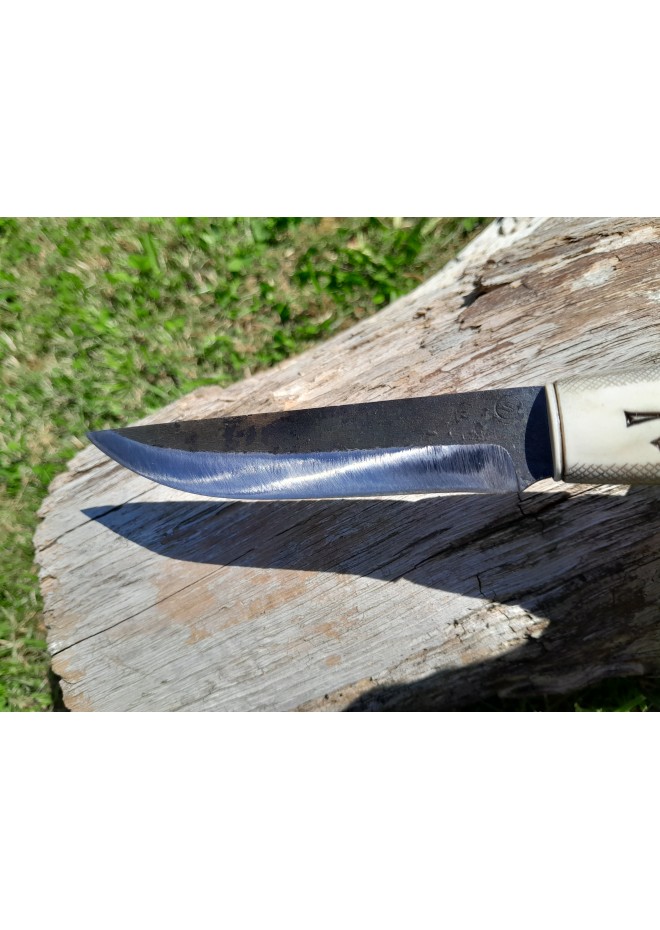 Viking knife with hand-carved Raven handle. Hand-forged carbon steel blade and leather sheath. 