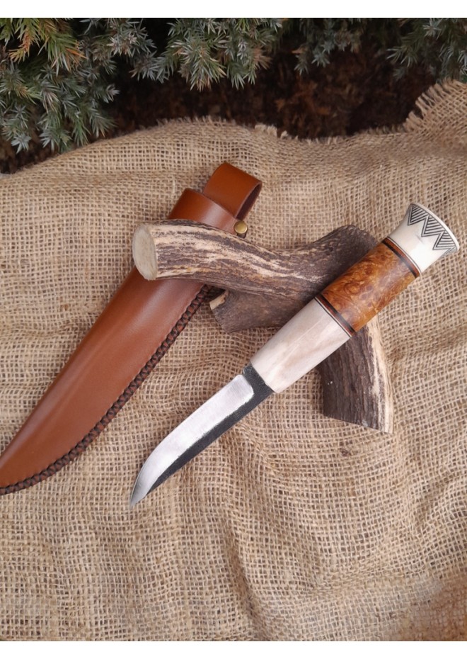 Handmade Finnish Puukko knife with master engraving and leather sheath. 