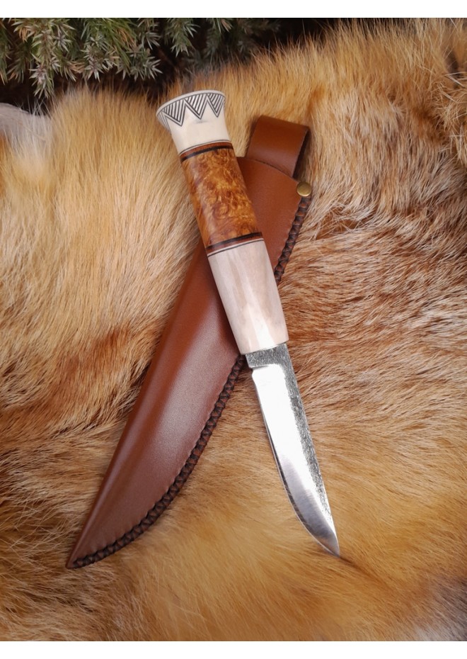 Handmade Finnish Puukko knife with master engraving and leather sheath. 