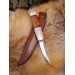 Handmade Finnish Puukko knife with master engraving and leather sheath. 