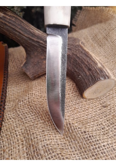 Handmade Finnish Puukko knife with master engraving and leather sheath. Hand-forged Carbon steel blade. Antler and wood handle.