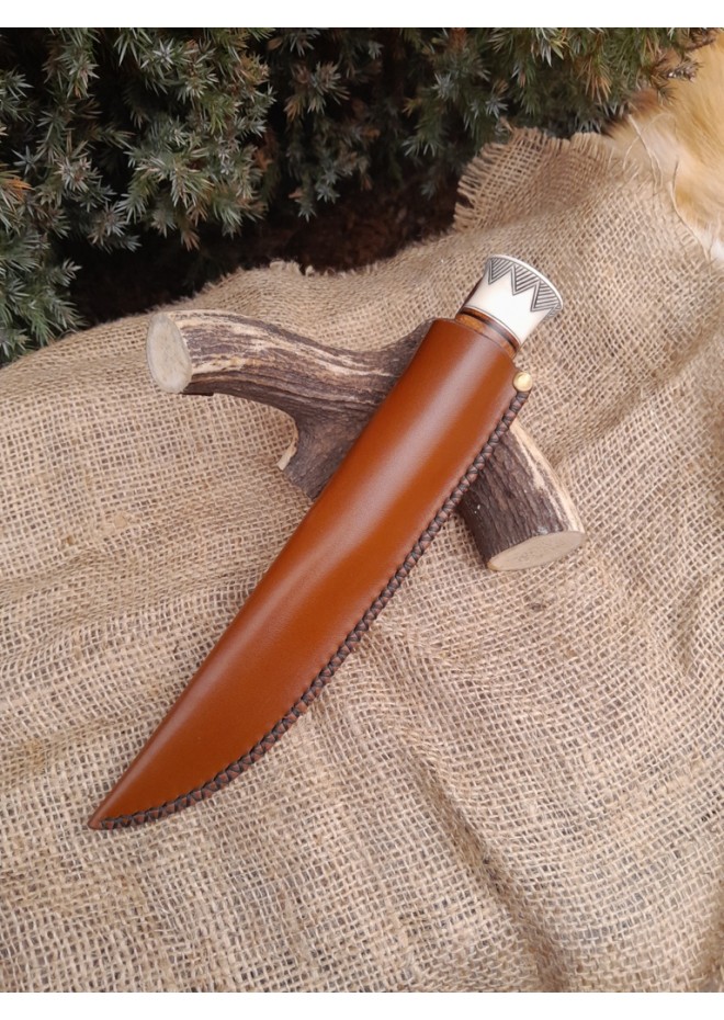 Handmade Finnish Puukko knife with master engraving and leather sheath. 