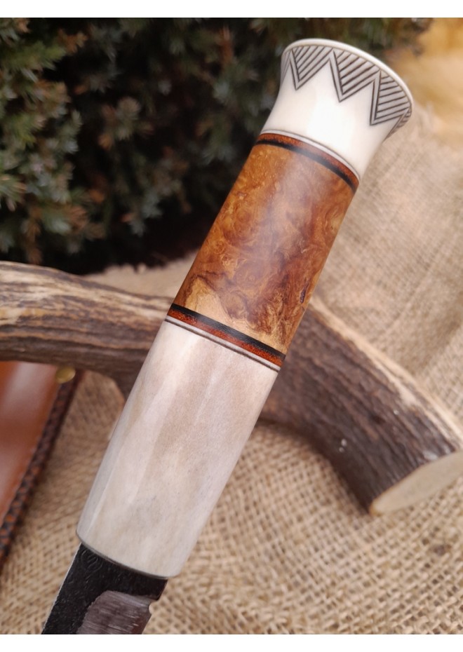 Handmade Finnish Puukko knife with master engraving and leather sheath. 