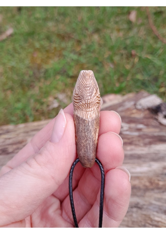 Small hand-carved Viking bear amulet with Algiz and Dagaz runes. Norse jewelry