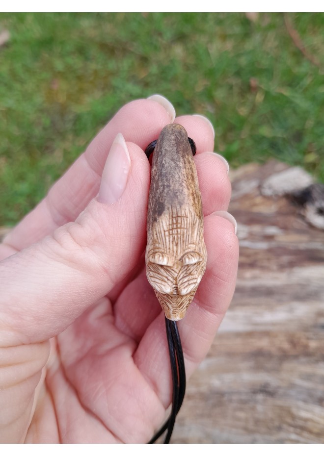 Small hand-carved Viking bear amulet with Algiz and Dagaz runes. Norse jewelry