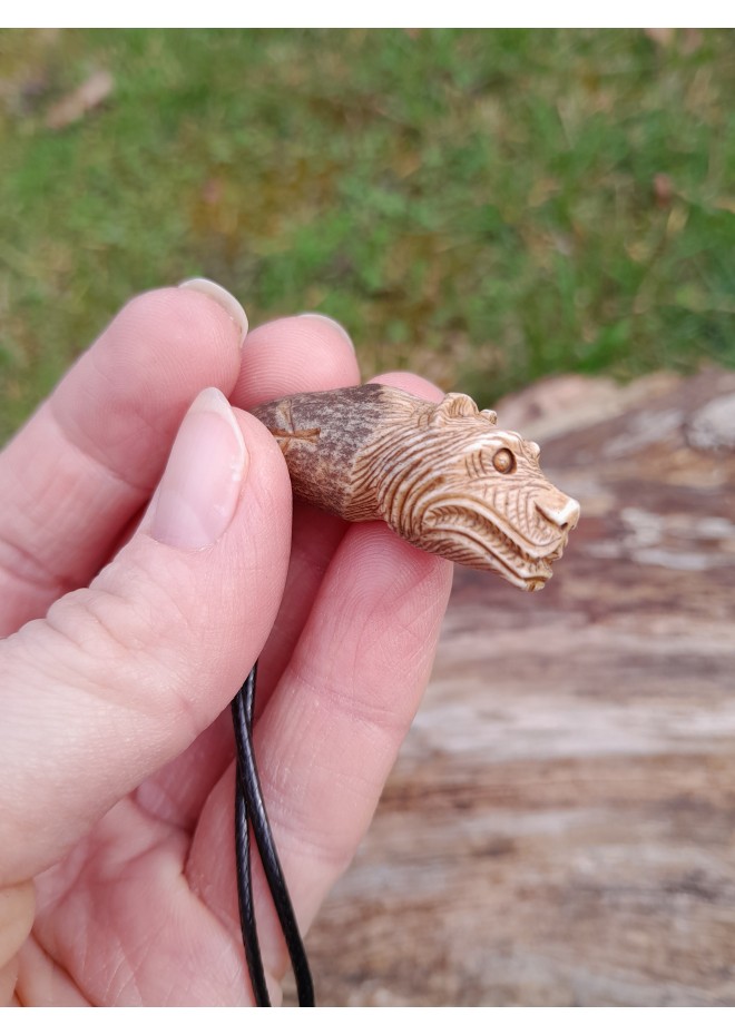 Small hand-carved Viking bear amulet with Algiz and Dagaz runes. Norse jewelry